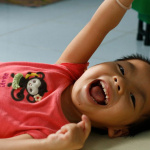 smile_yumi A child at an orphanage about an hour outside of Ho Chi Minh City. Photo by Yumi Wilson